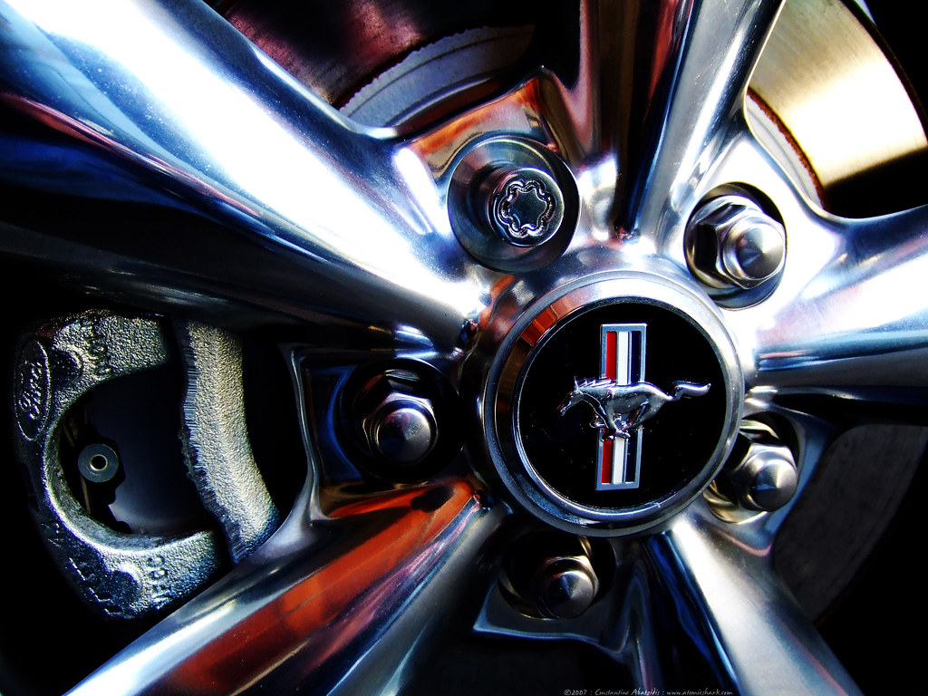The same wheel polished to a brilliant chrome shine after professional wheel detailing